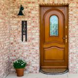 Vertical_House_Number_with_Stakes_Black_Brick_Entrance_Mockup.png