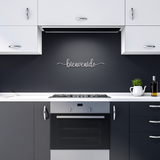 Bienvenido_-_Welcome_in_Spanish_Metal_Wa_Silver_Dark_Kitchen_Mockup.png
